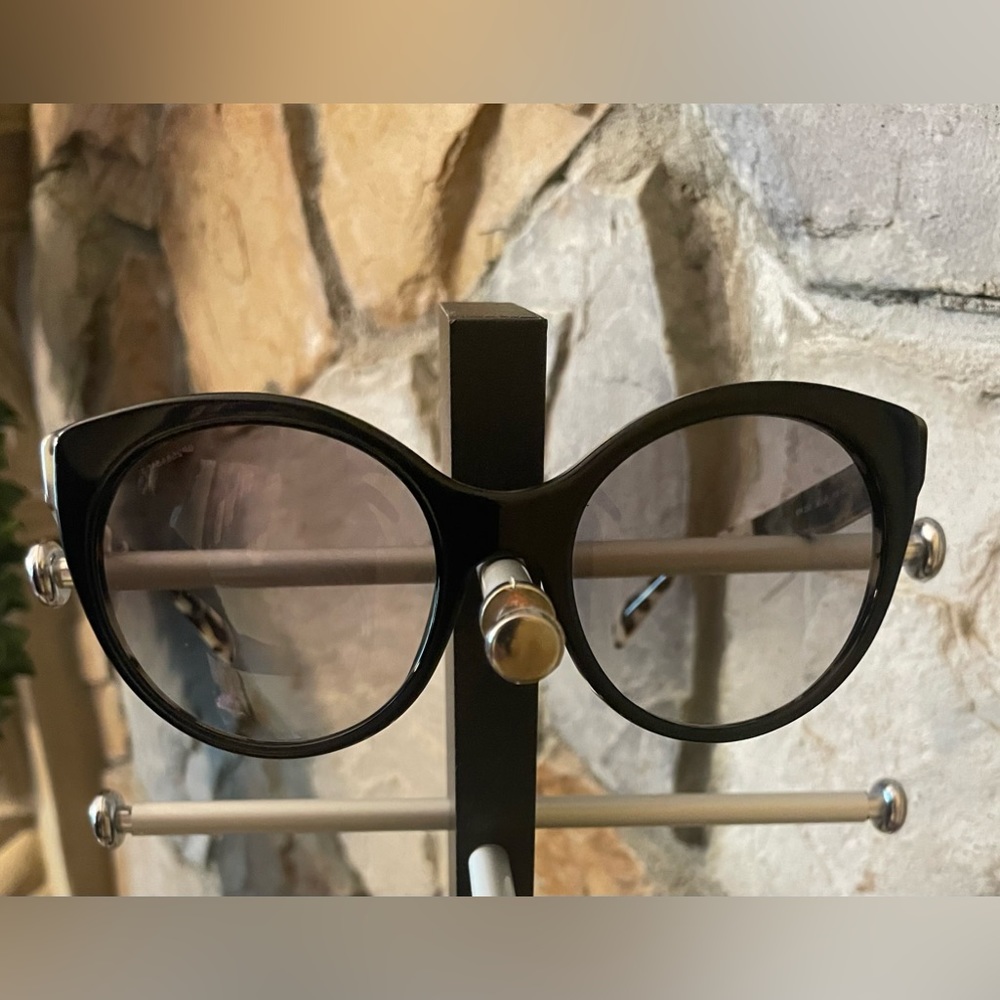 Authentic Prada sunglasses. Case included.